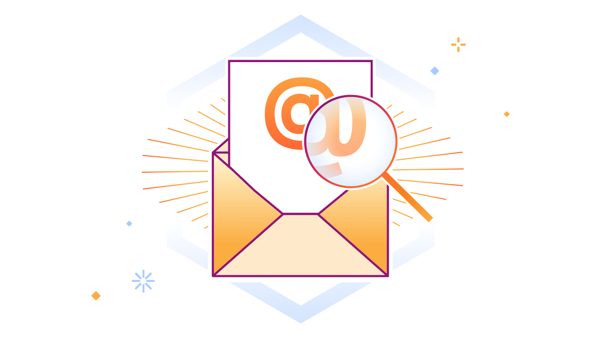 E-Mail-@-Zeichen wird durch eine Lupe vergrößert